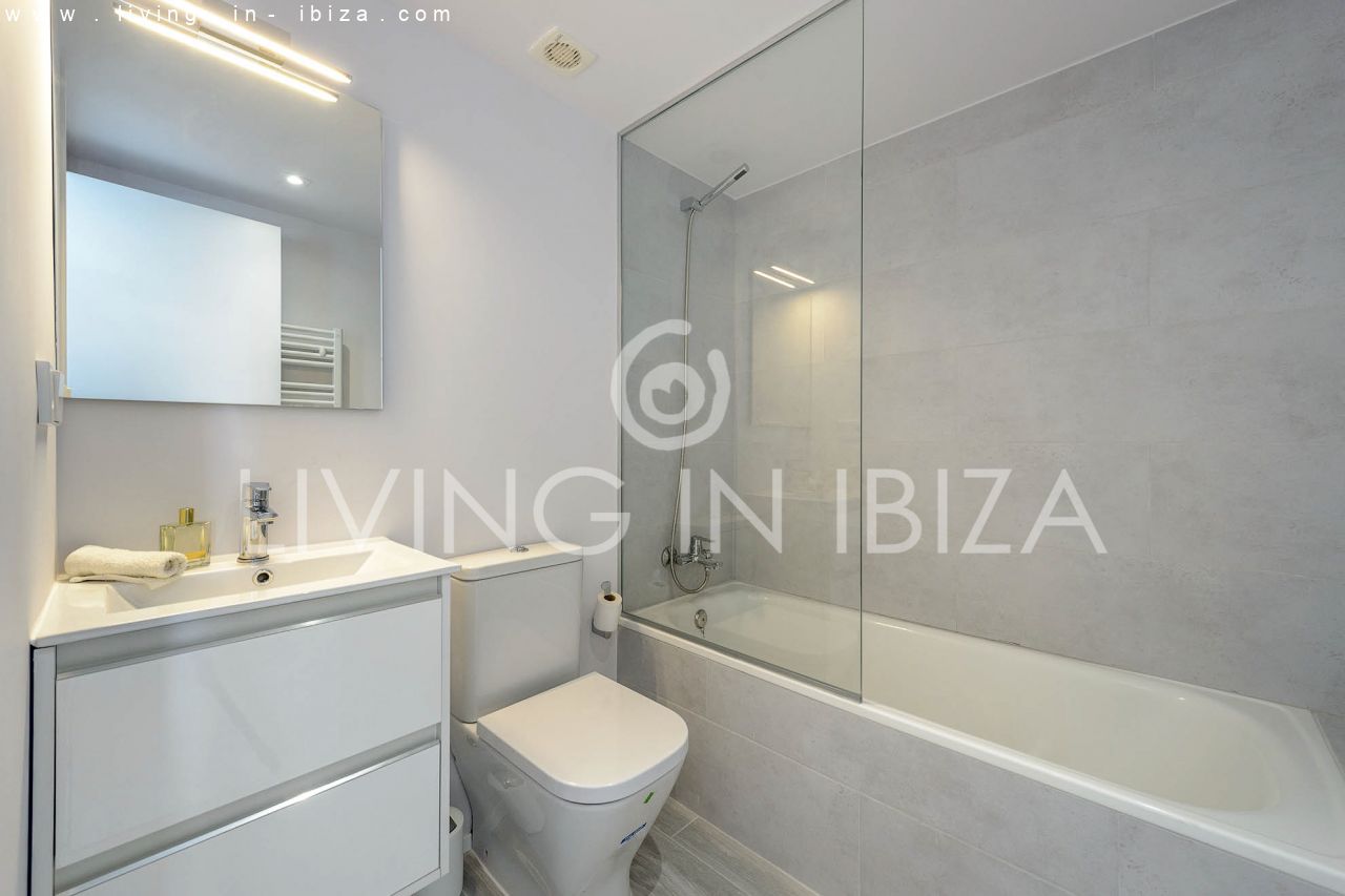 Seasonal RENTAL Attractive design apartment with parking space, in Santa Eulalia del Río, Ibiza, first sea line. Close to the beach. From the 1/10 -