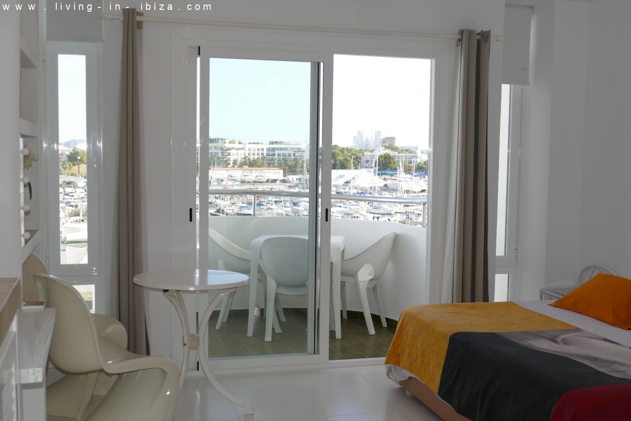 Seasonal temporary rental, cozy studio apartment with sea views on first line on promenade of Santa Eulalia del Rio, Ibiza.