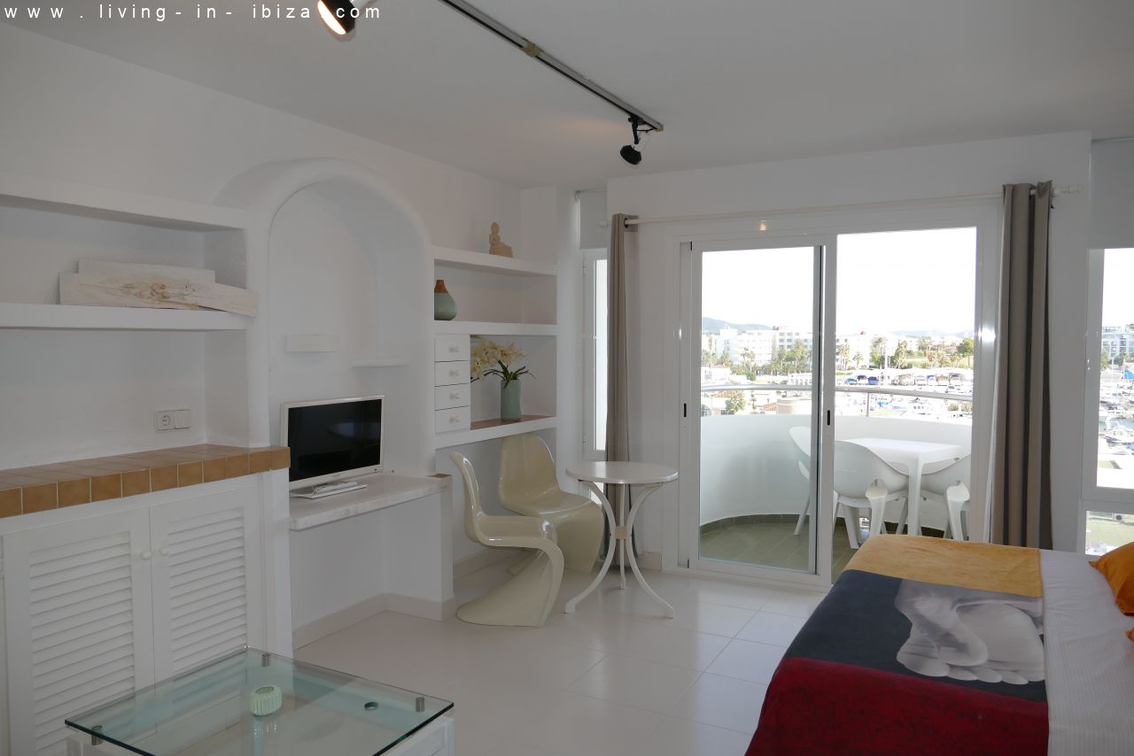 Seasonal temporary rental, cozy studio apartment with sea views on first line on promenade of Santa Eulalia del Rio, Ibiza.