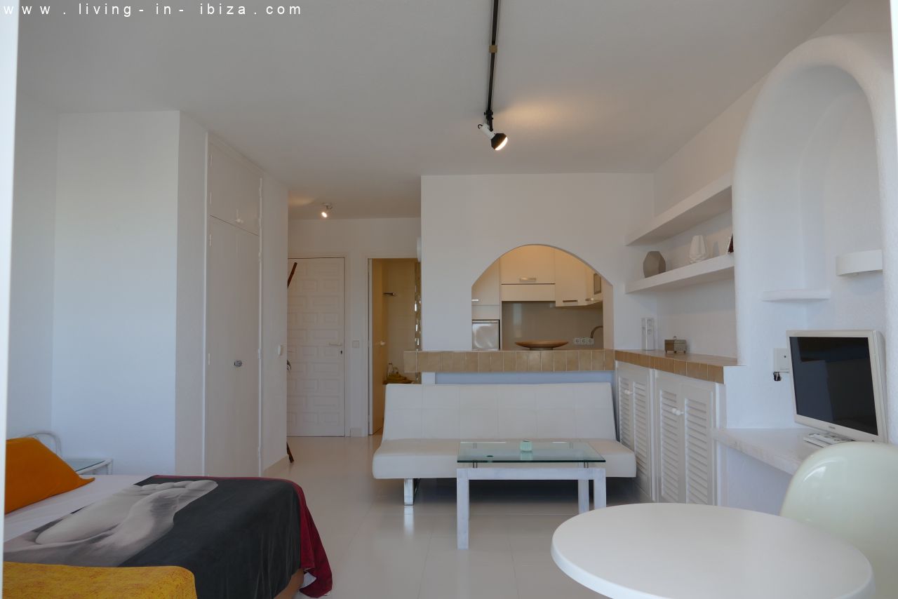 Seasonal temporary rental, cozy studio apartment with sea views on first line on promenade of Santa Eulalia del Rio, Ibiza.