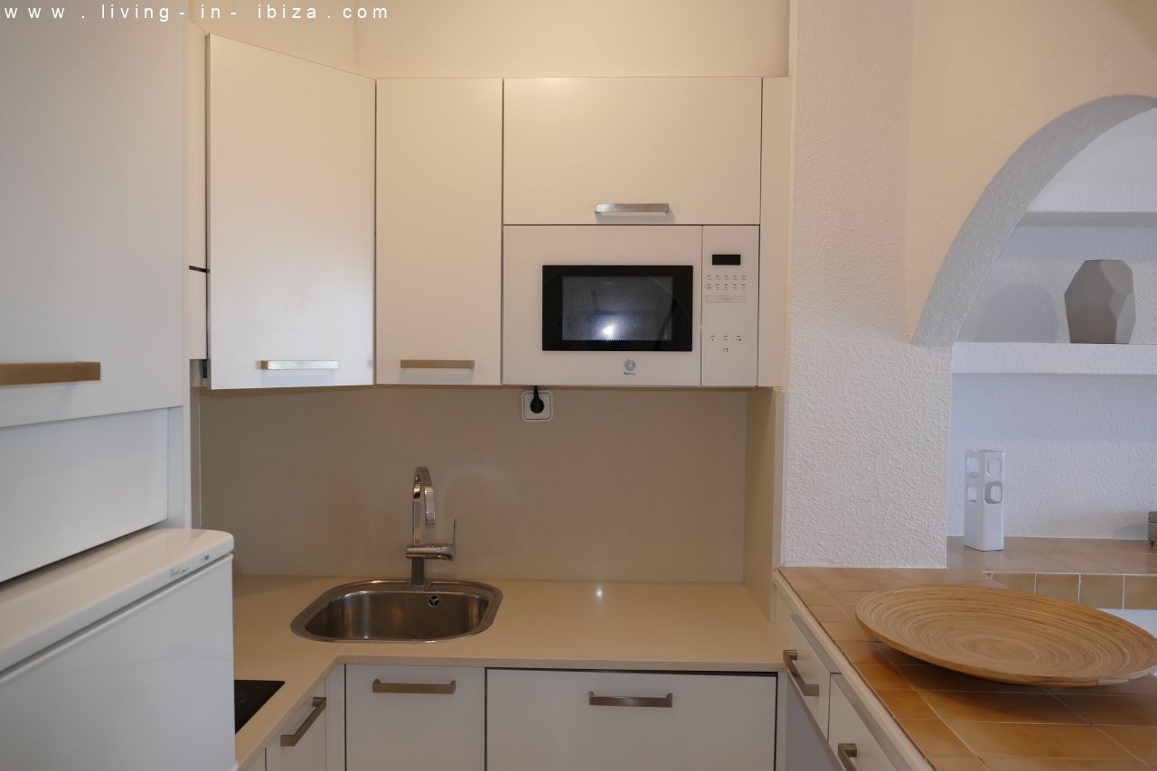 Seasonal temporary rental, cozy studio apartment with sea views on first line on promenade of Santa Eulalia del Rio, Ibiza.