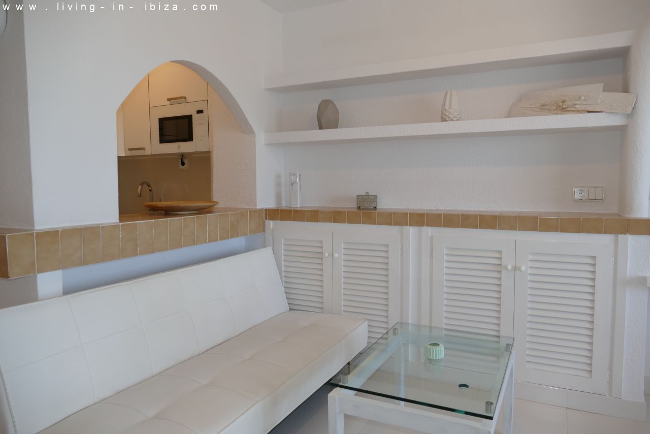 Seasonal temporary rental, cozy studio apartment with sea views on first line on promenade of Santa Eulalia del Rio, Ibiza.
