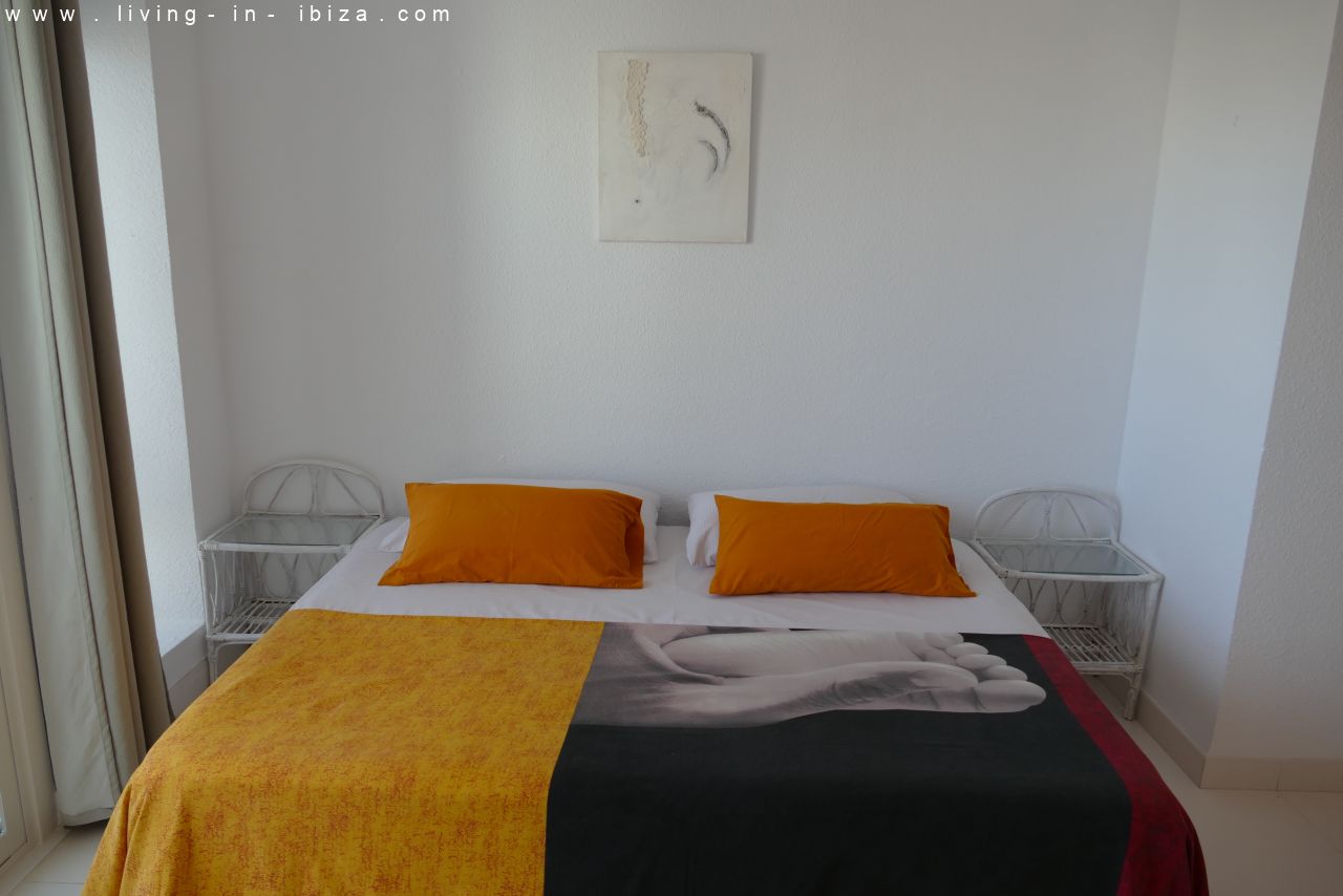 Seasonal temporary rental, cozy studio apartment with sea views on first line on promenade of Santa Eulalia del Rio, Ibiza.