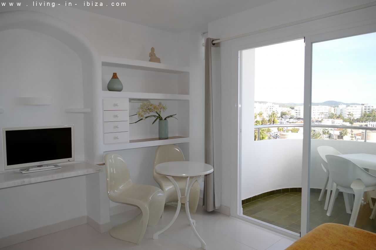 Seasonal temporary rental, cozy studio apartment with sea views on first line on promenade of Santa Eulalia del Rio, Ibiza.