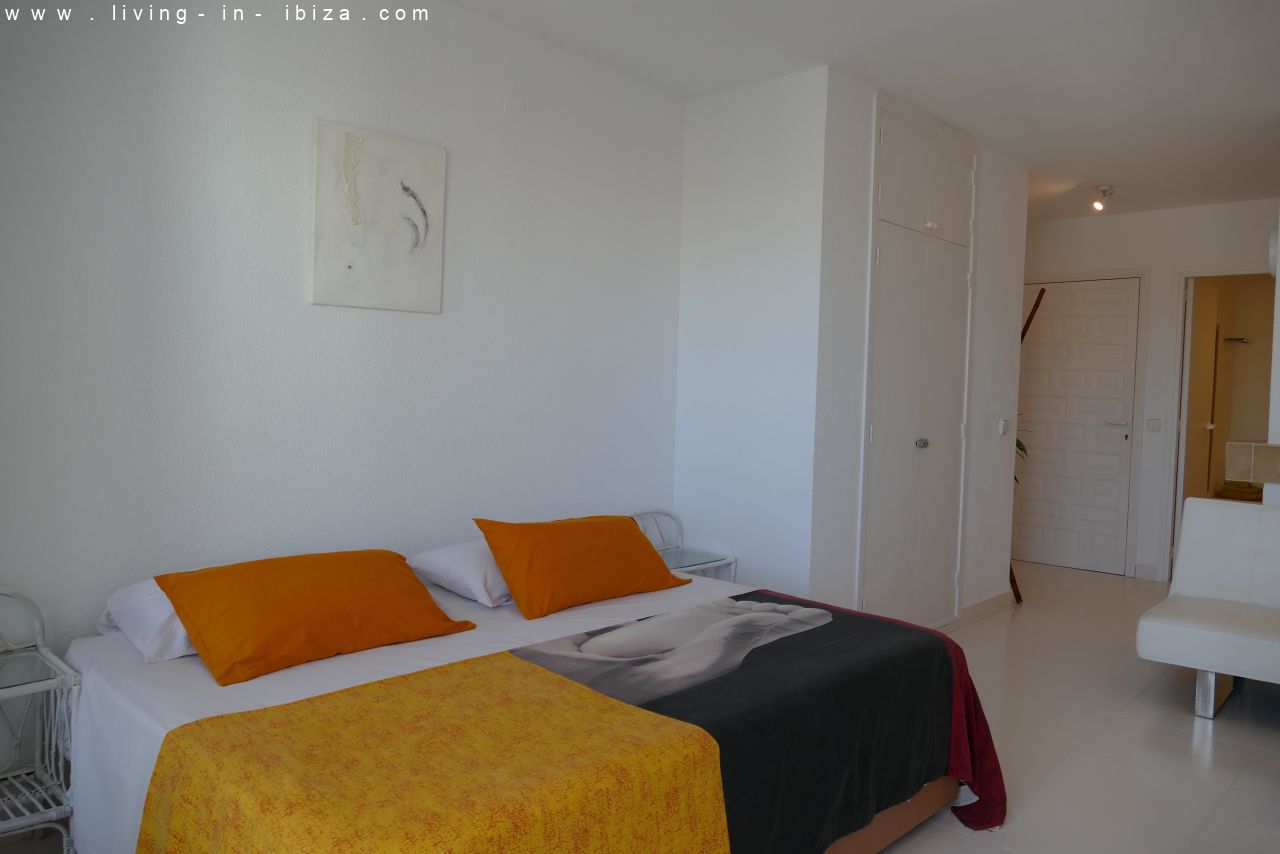 Seasonal temporary rental, cozy studio apartment with sea views on first line on promenade of Santa Eulalia del Rio, Ibiza.