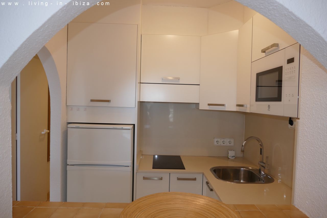 Seasonal temporary rental, cozy studio apartment with sea views on first line on promenade of Santa Eulalia del Rio, Ibiza.