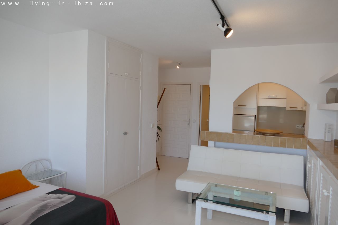 Seasonal temporary rental, cozy studio apartment with sea views on first line on promenade of Santa Eulalia del Rio, Ibiza.