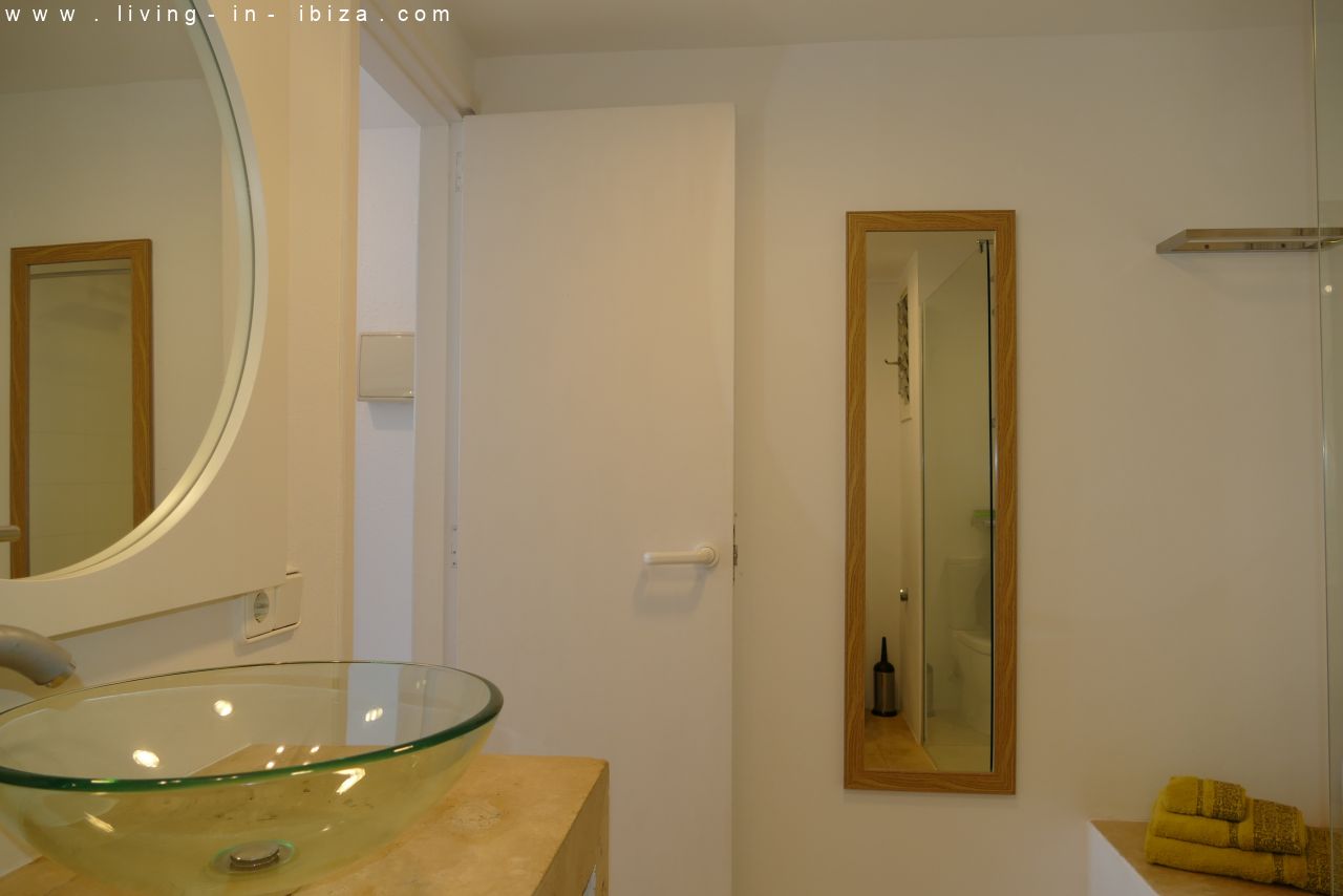 Seasonal temporary rental, cozy studio apartment with sea views on first line on promenade of Santa Eulalia del Rio, Ibiza.