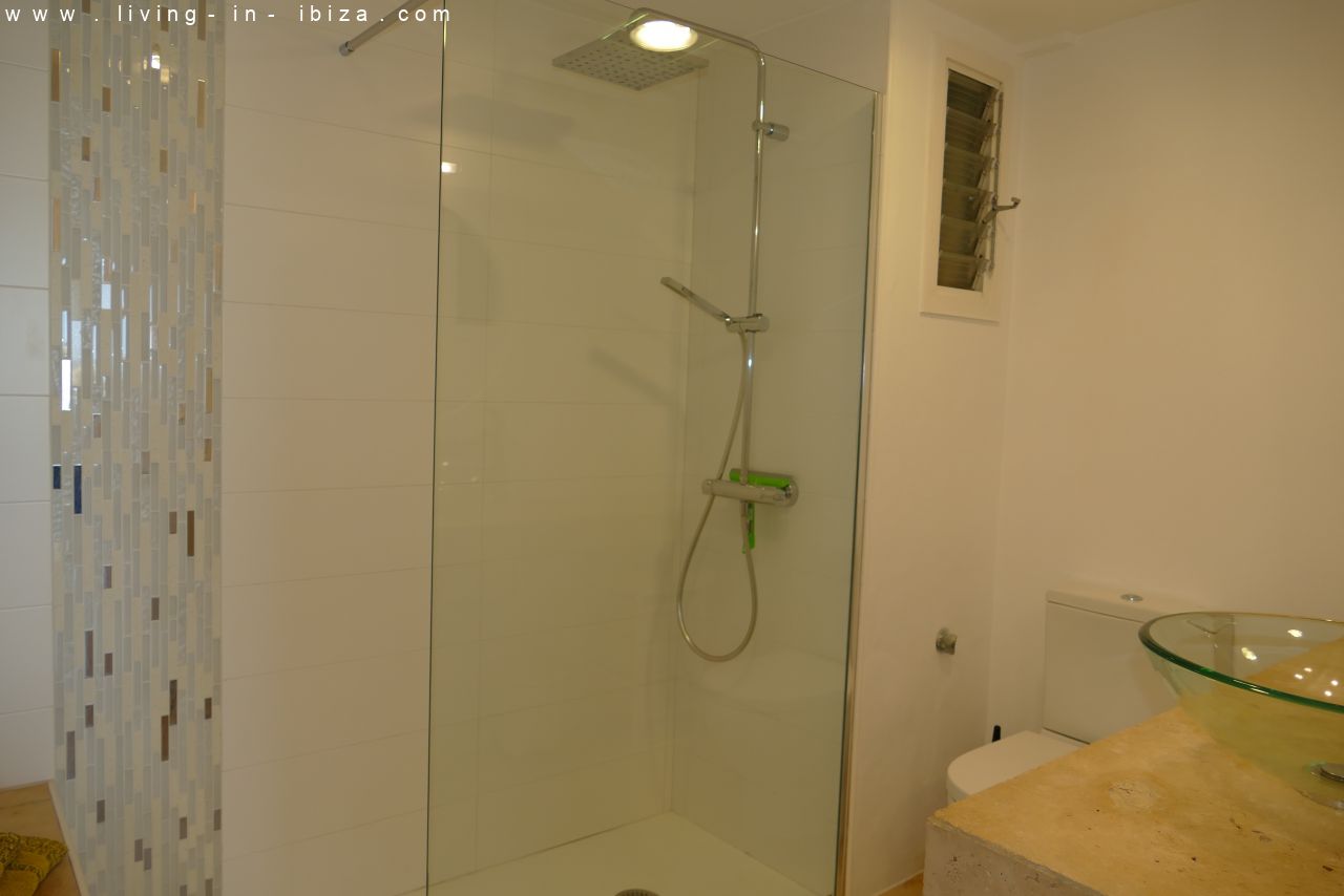 Seasonal temporary rental, cozy studio apartment with sea views on first line on promenade of Santa Eulalia del Rio, Ibiza.