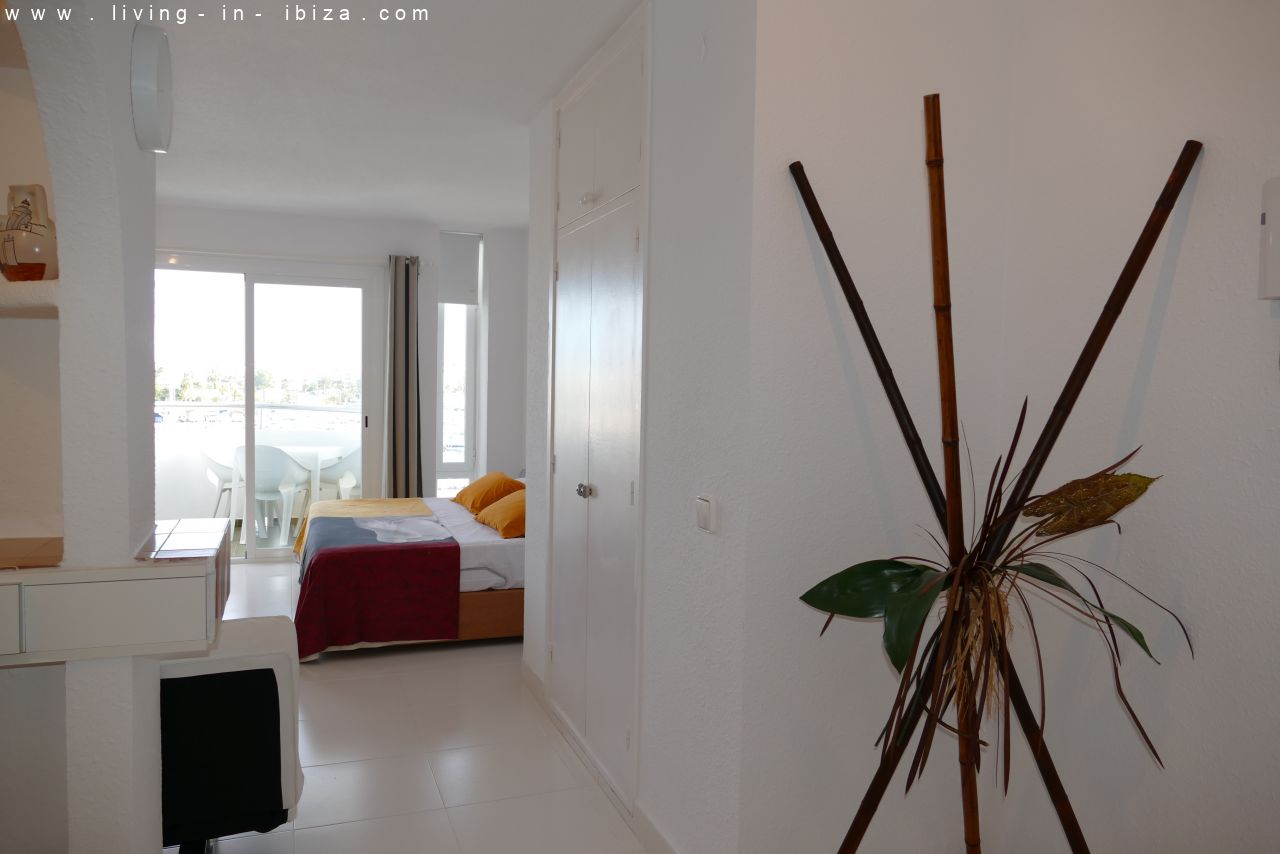 Seasonal temporary rental, cozy studio apartment with sea views on first line on promenade of Santa Eulalia del Rio, Ibiza.