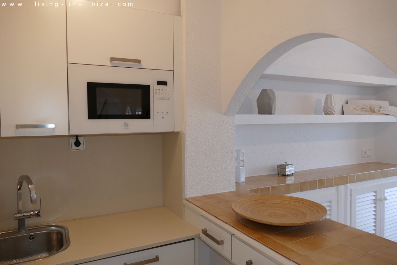 Seasonal temporary rental, cozy studio apartment with sea views on first line on promenade of Santa Eulalia del Rio, Ibiza.
