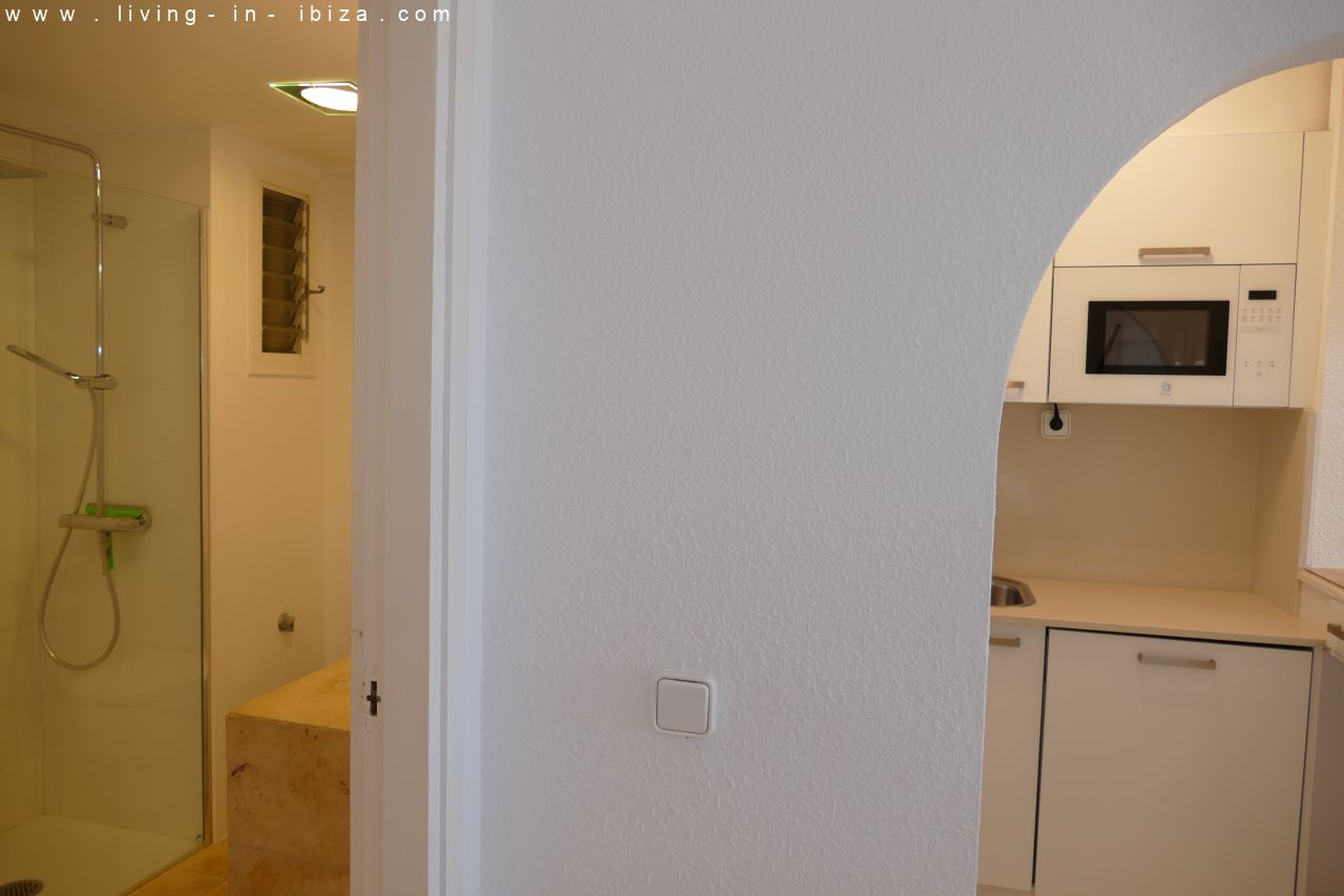 Seasonal temporary rental, cozy studio apartment with sea views on first line on promenade of Santa Eulalia del Rio, Ibiza.