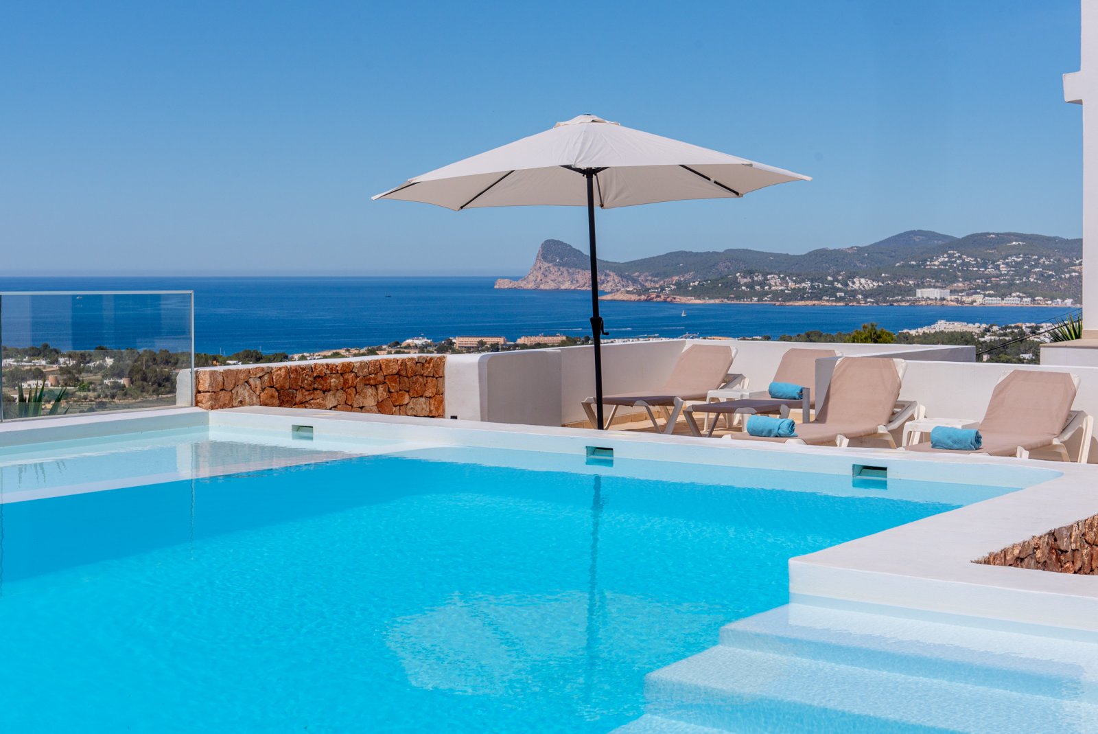 Stunning 8 bedroom, 3 storey villa with private pool and 180 degree sea and sunset views. Nestled on a mountain hill of Ibiza, Cala Conta