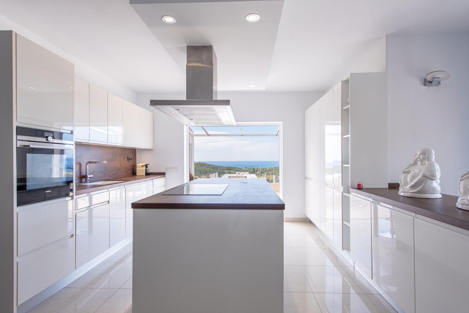 Stunning 8 bedroom, 3 storey villa with private pool and 180 degree sea and sunset views. Nestled on a mountain hill of Ibiza, Cala Conta