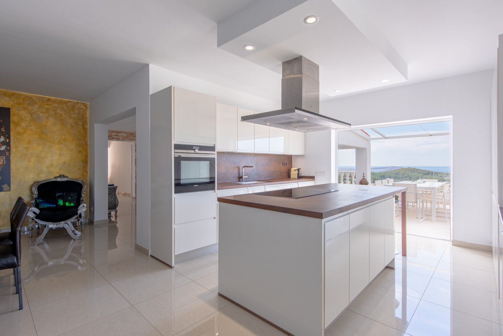 Stunning 8 bedroom, 3 storey villa with private pool and 180 degree sea and sunset views. Nestled on a mountain hill of Ibiza, Cala Conta