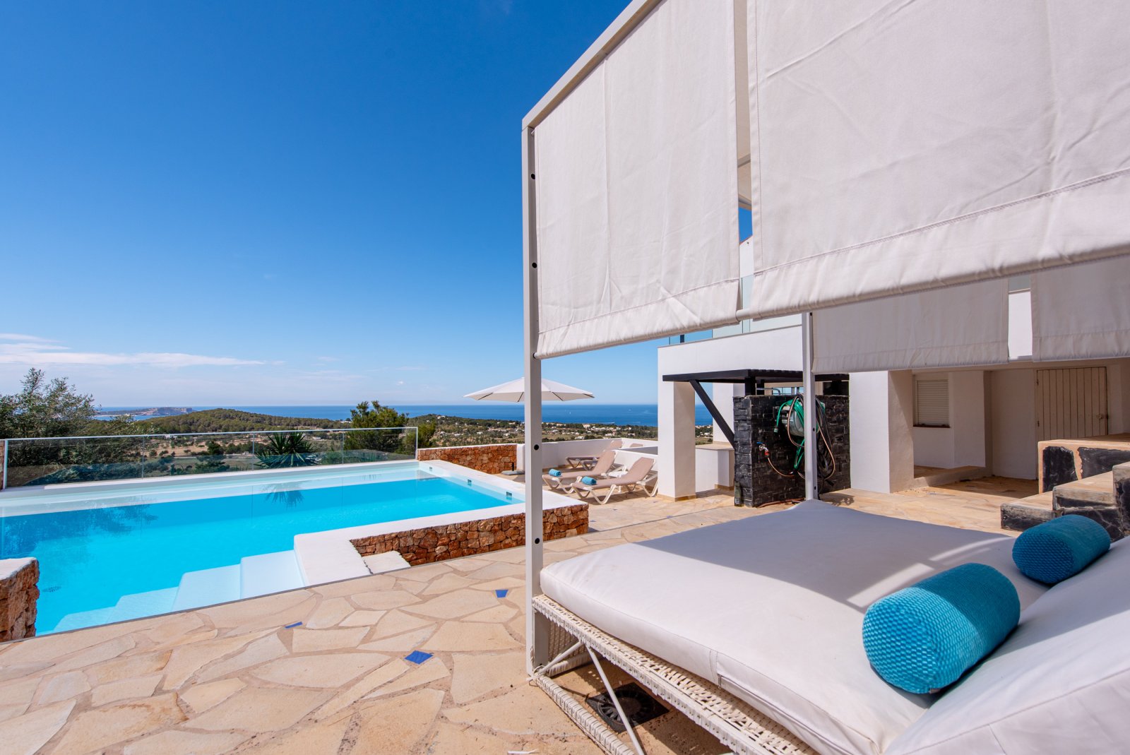 Stunning 8 bedroom, 3 storey villa with private pool and 180 degree sea and sunset views. Nestled on a mountain hill of Ibiza, Cala Conta