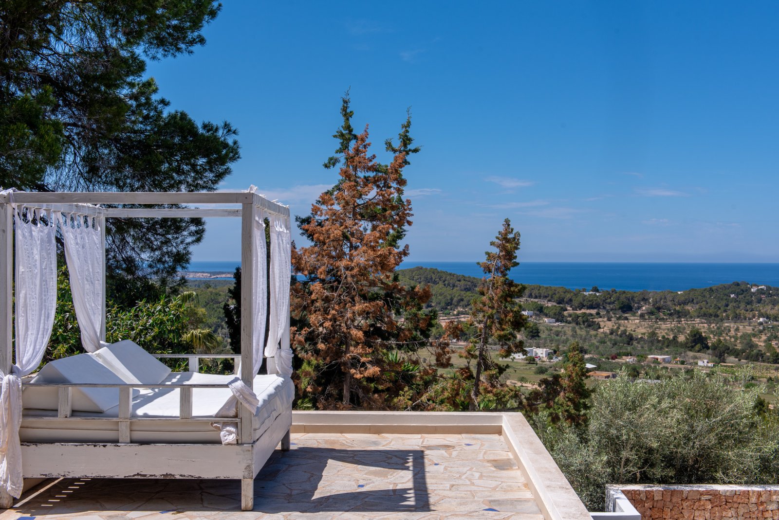 Stunning 8 bedroom, 3 storey villa with private pool and 180 degree sea and sunset views. Nestled on a mountain hill of Ibiza, Cala Conta