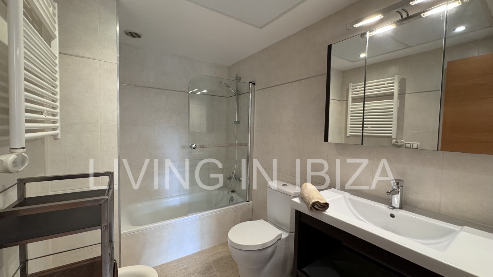 Bright and comfortable 2 bedroom ground floor apartment with terrace, pool, garage, near the beach in Santa Eulalia, Ibiza for long term rental