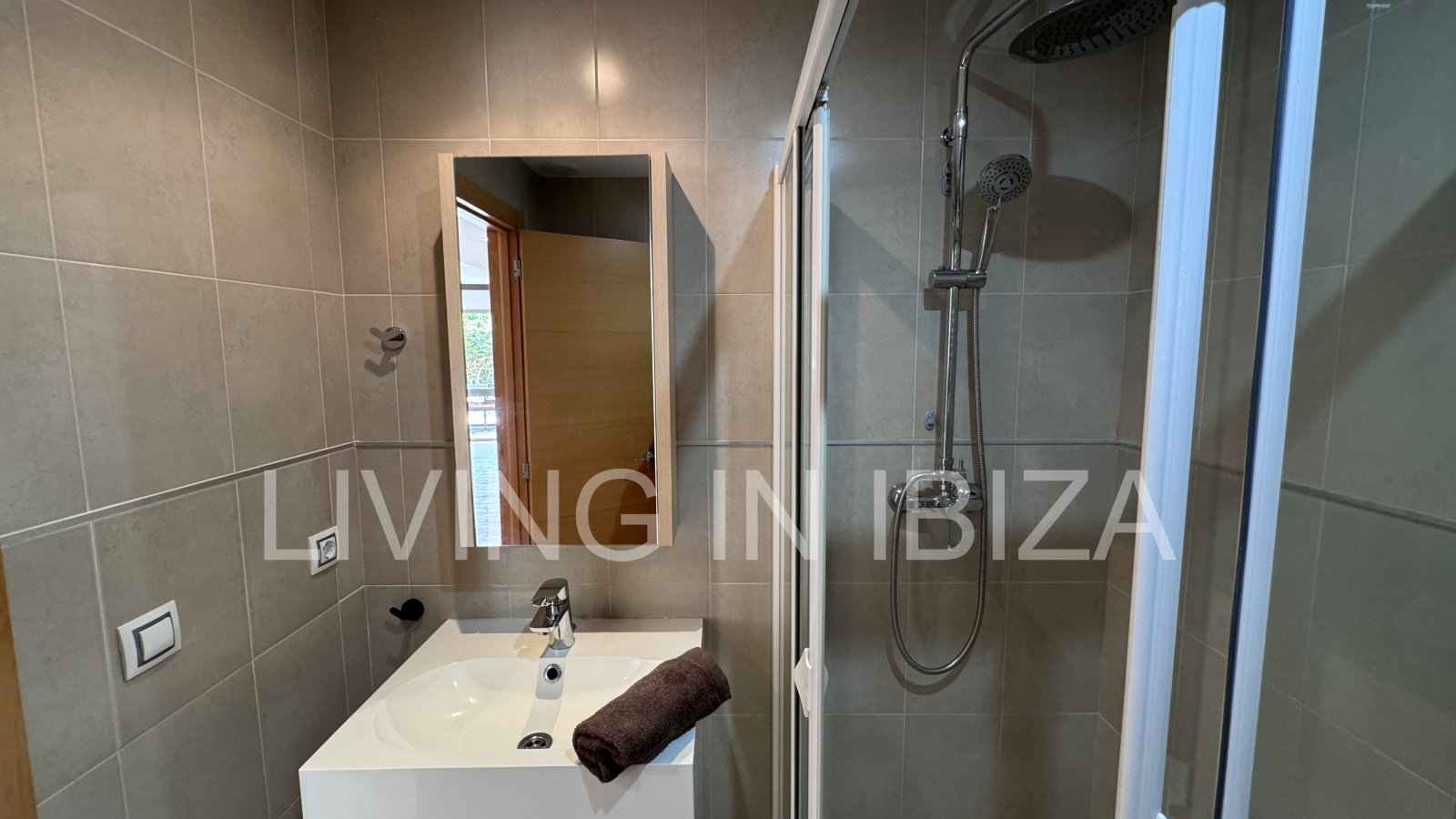 Bright and comfortable 2 bedroom ground floor apartment with terrace, pool, garage, near the beach in Santa Eulalia, Ibiza for long term rental