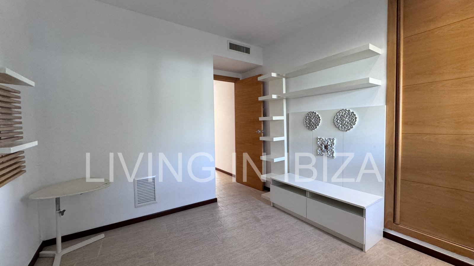 Bright and comfortable 2 bedroom ground floor apartment with terrace, pool, garage, near the beach in Santa Eulalia, Ibiza for long term rental