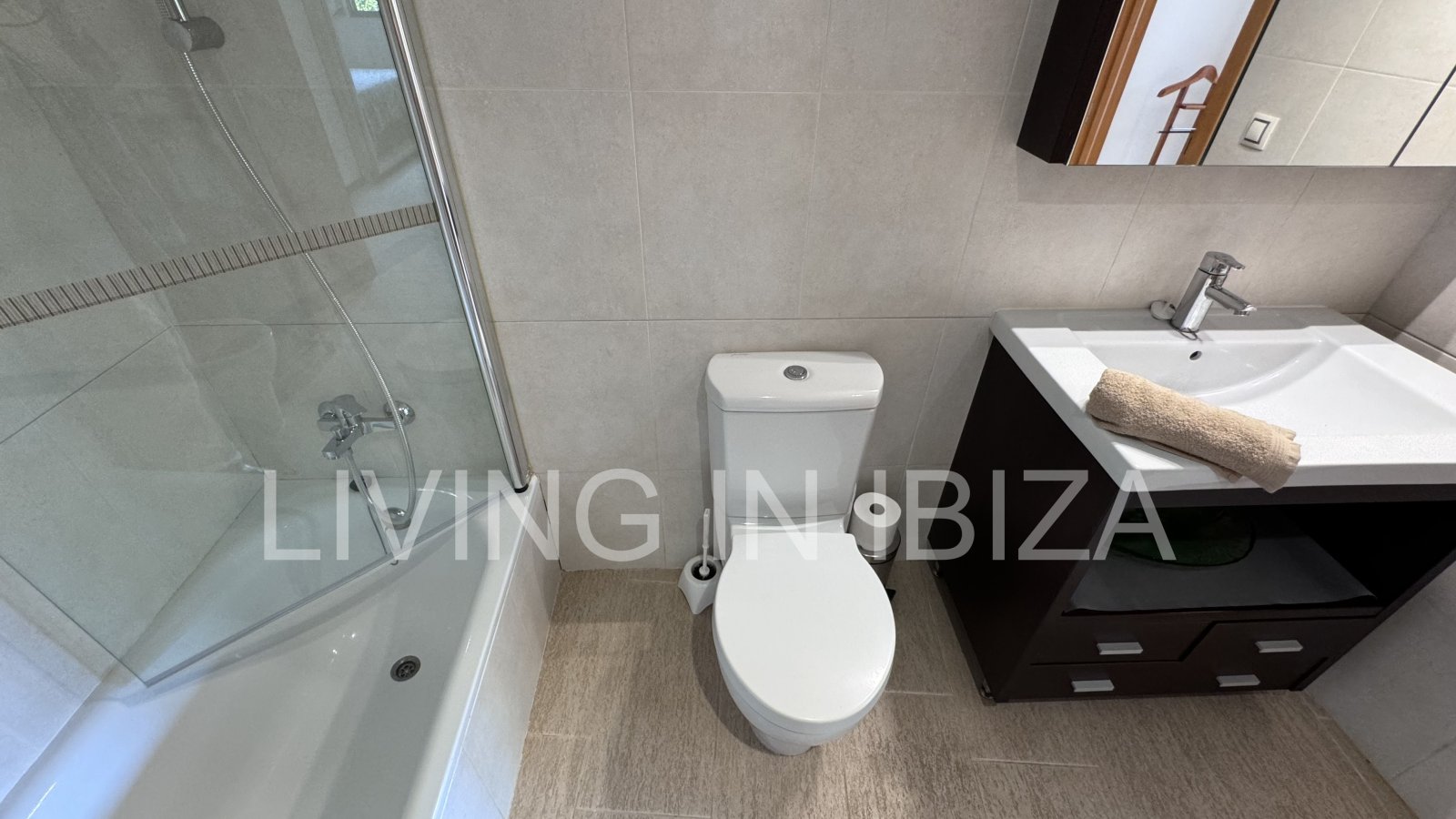 Bright and comfortable 2 bedroom ground floor apartment with terrace, pool, garage, near the beach in Santa Eulalia, Ibiza for long term rental