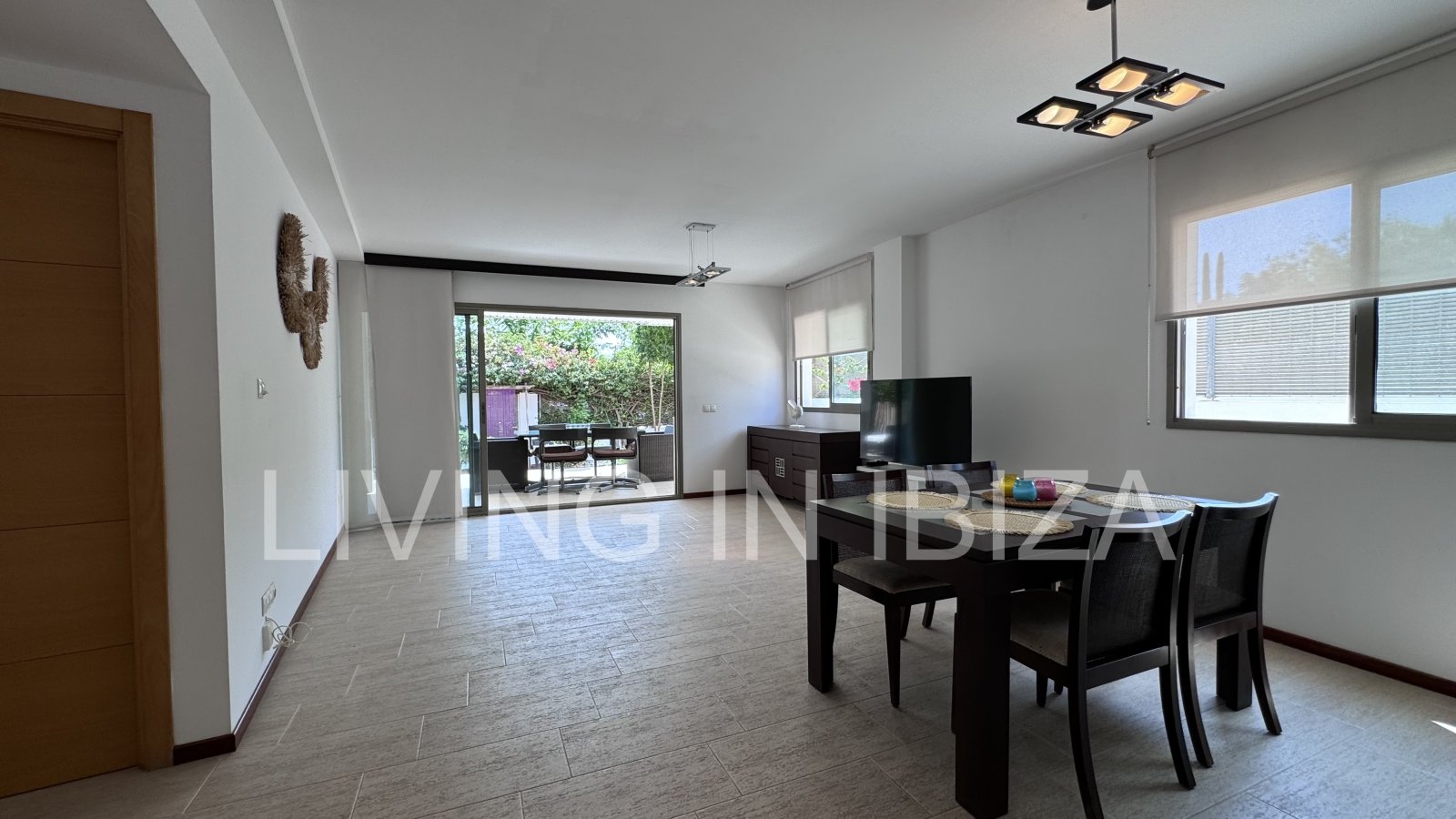 Bright and comfortable 2 bedroom ground floor apartment with terrace, pool, garage, near the beach in Santa Eulalia, Ibiza for long term rental