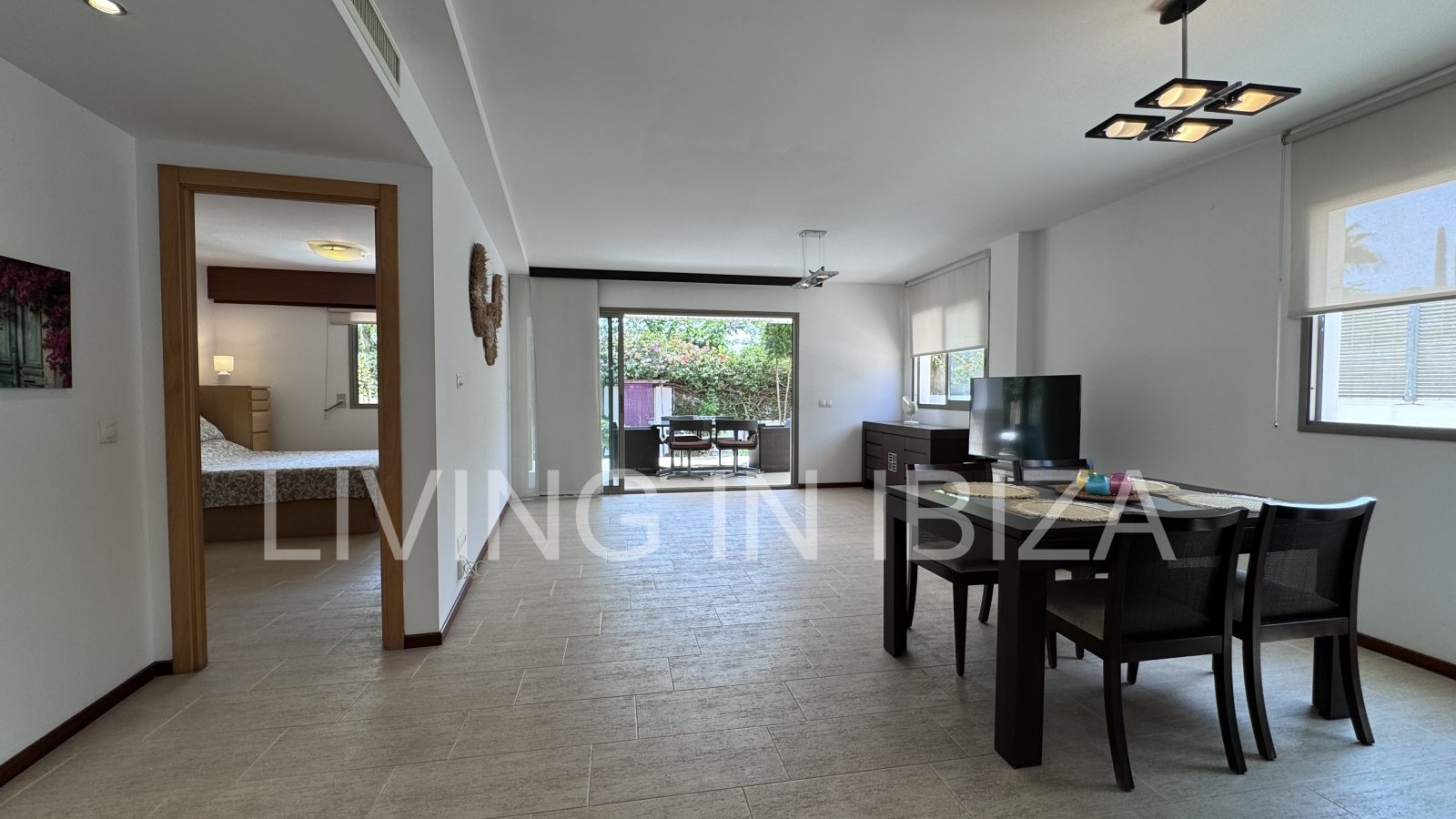 Bright and comfortable 2 bedroom ground floor apartment with terrace, pool, garage, near the beach in Santa Eulalia, Ibiza for long term rental