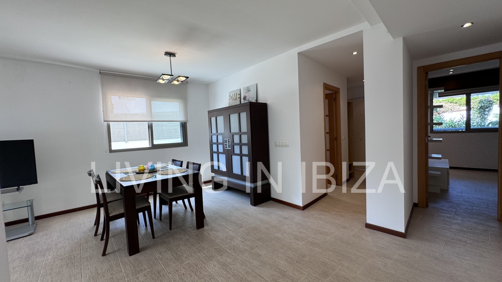 Bright and comfortable 2 bedroom ground floor apartment with terrace, pool, garage, near the beach in Santa Eulalia, Ibiza for long term rental