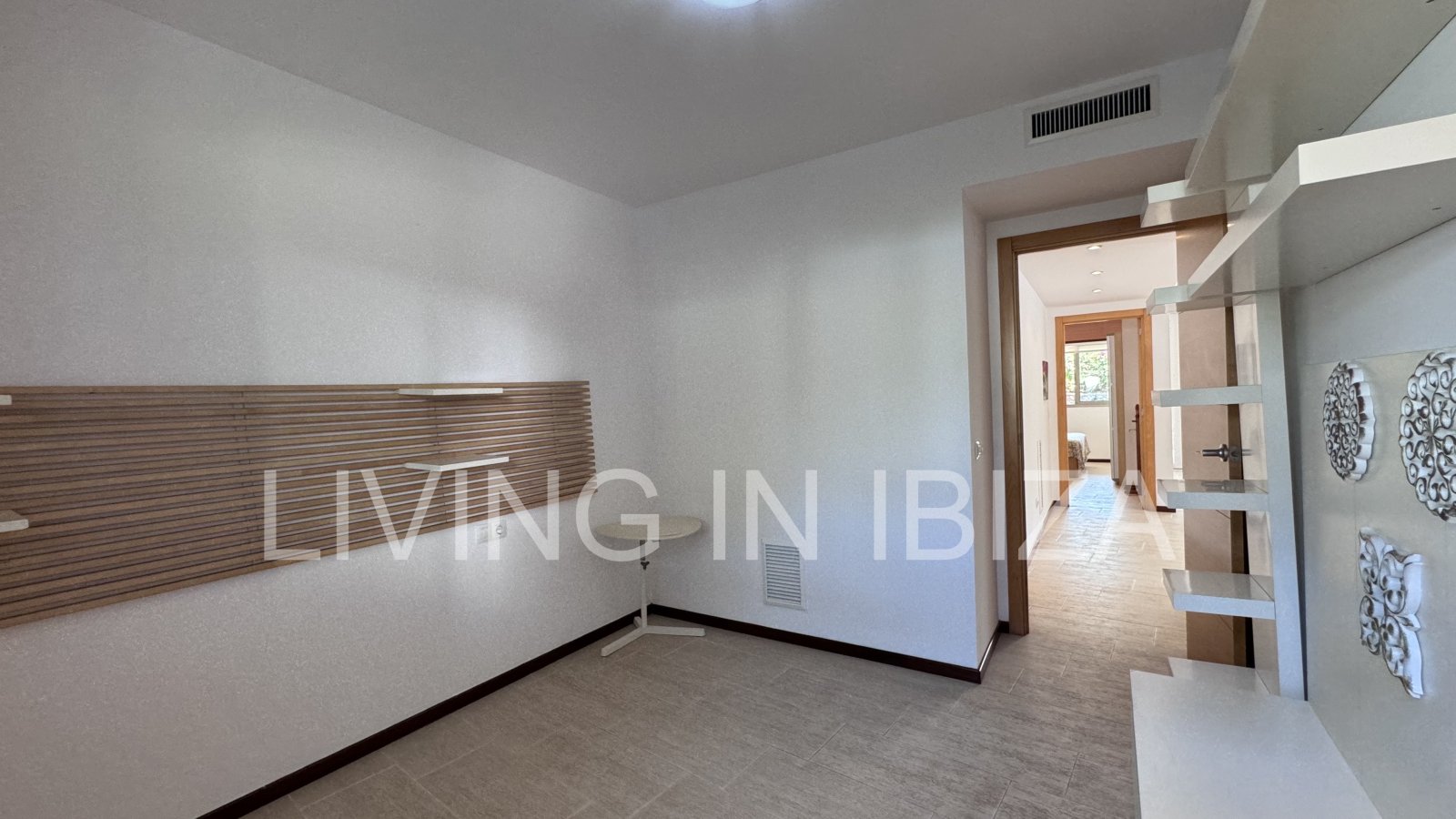 Bright and comfortable 2 bedroom ground floor apartment with terrace, pool, garage, near the beach in Santa Eulalia, Ibiza for long term rental