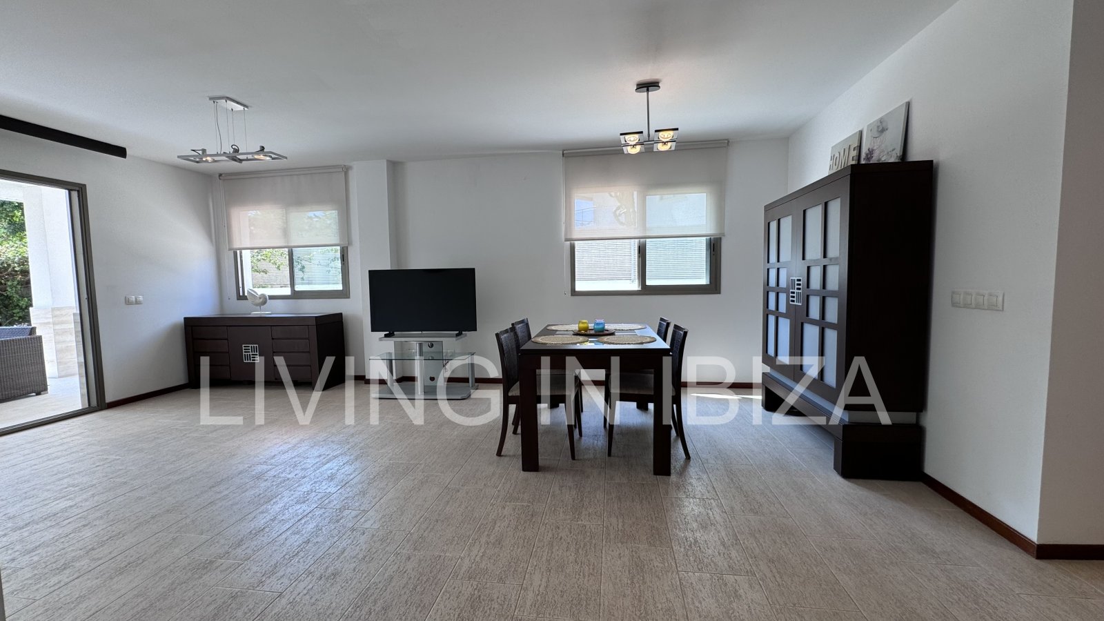 Bright and comfortable 2 bedroom ground floor apartment with terrace, pool, garage, near the beach in Santa Eulalia, Ibiza for long term rental