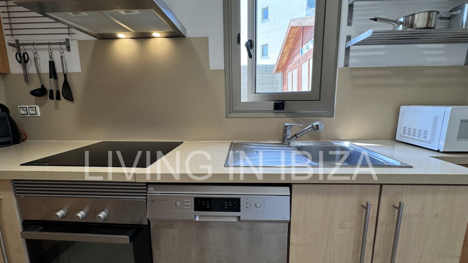 Bright and comfortable 2 bedroom ground floor apartment with terrace, pool, garage, near the beach in Santa Eulalia, Ibiza for long term rental