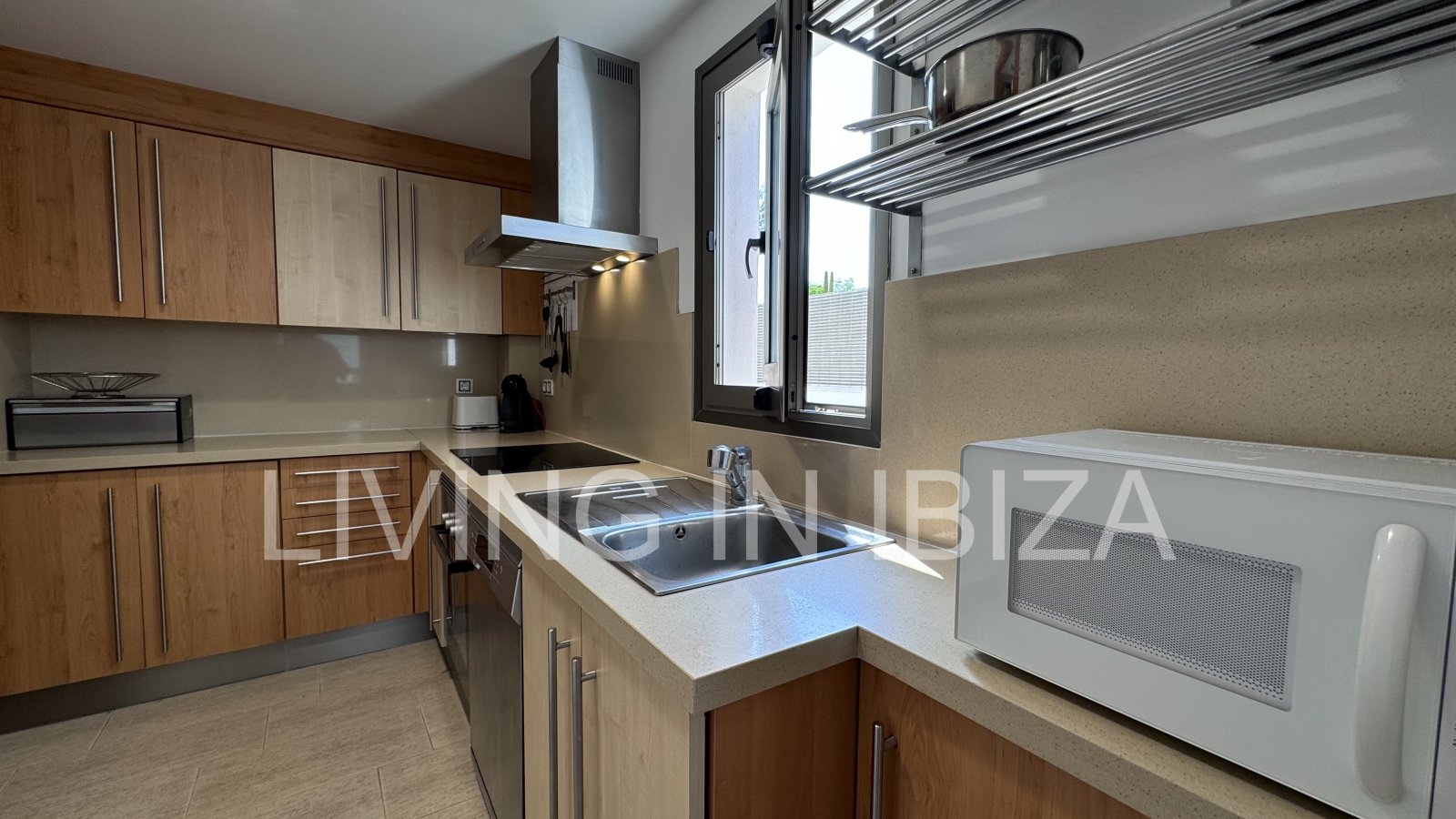 Bright and comfortable 2 bedroom ground floor apartment with terrace, pool, garage, near the beach in Santa Eulalia, Ibiza for long term rental