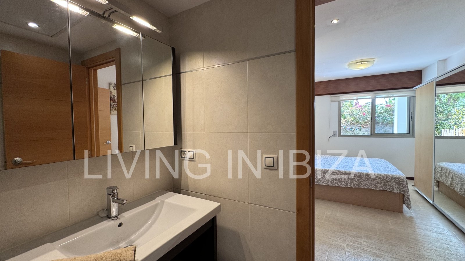 Bright and comfortable 2 bedroom ground floor apartment with terrace, pool, garage, near the beach in Santa Eulalia, Ibiza for long term rental