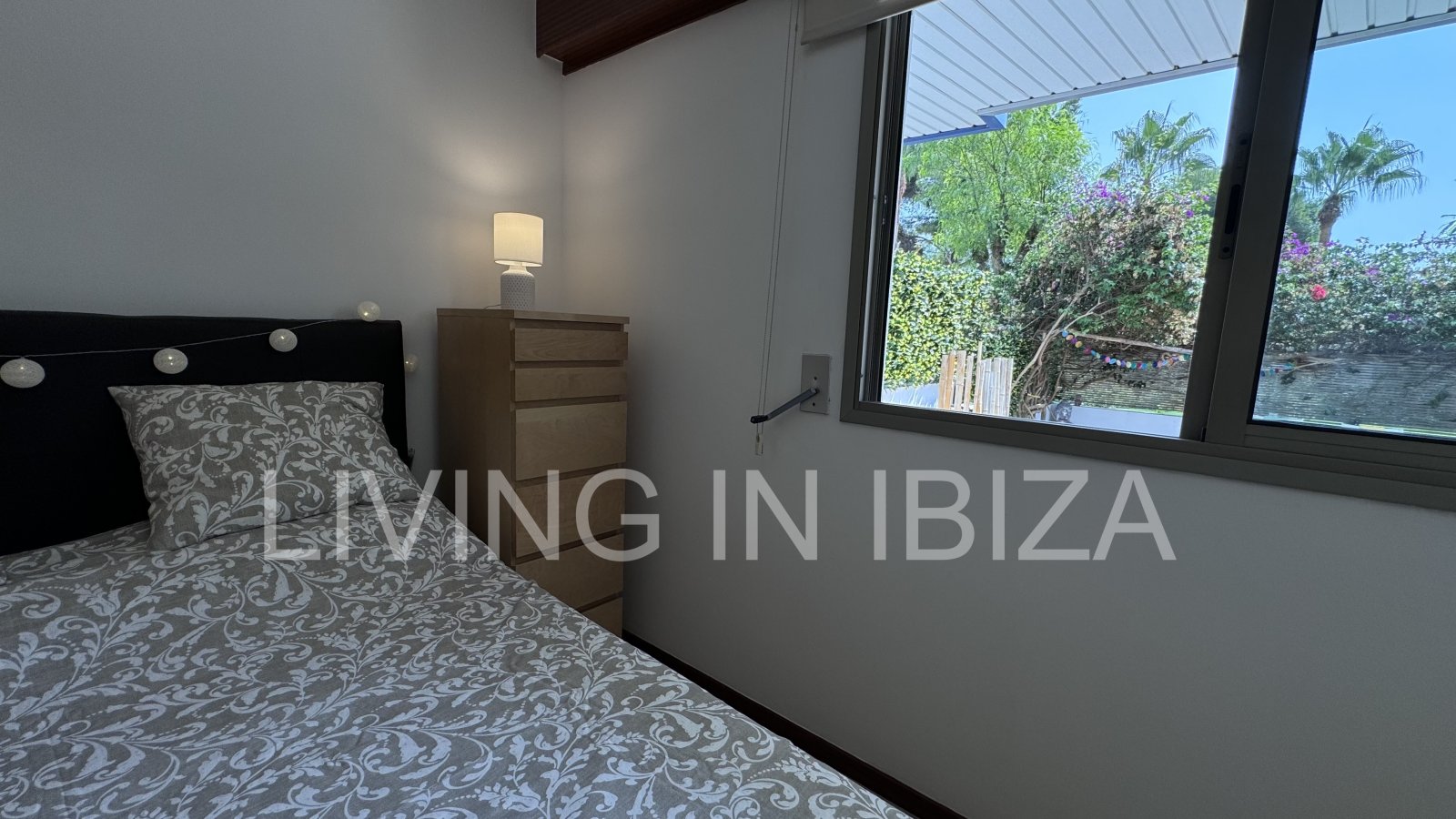 Bright and comfortable 2 bedroom ground floor apartment with terrace, pool, garage, near the beach in Santa Eulalia, Ibiza for long term rental