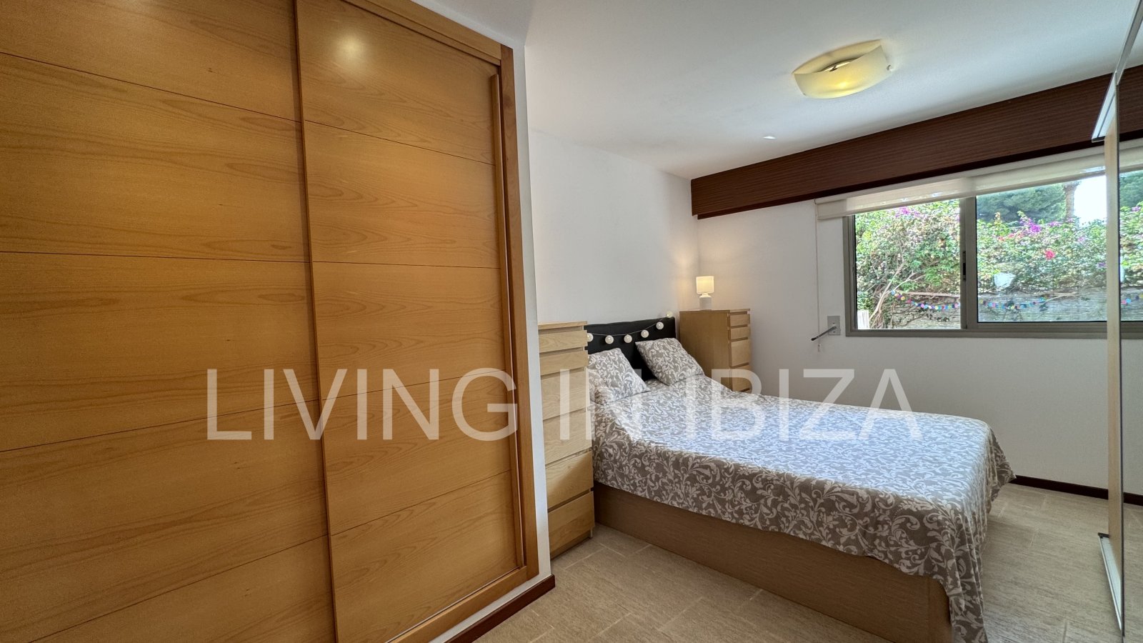 Bright and comfortable 2 bedroom ground floor apartment with terrace, pool, garage, near the beach in Santa Eulalia, Ibiza for long term rental