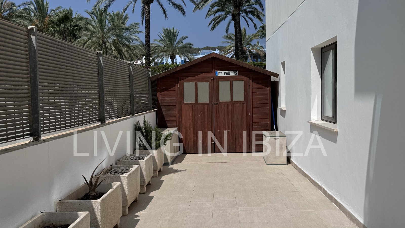 Bright and comfortable 2 bedroom ground floor apartment with terrace, pool, garage, near the beach in Santa Eulalia, Ibiza for long term rental