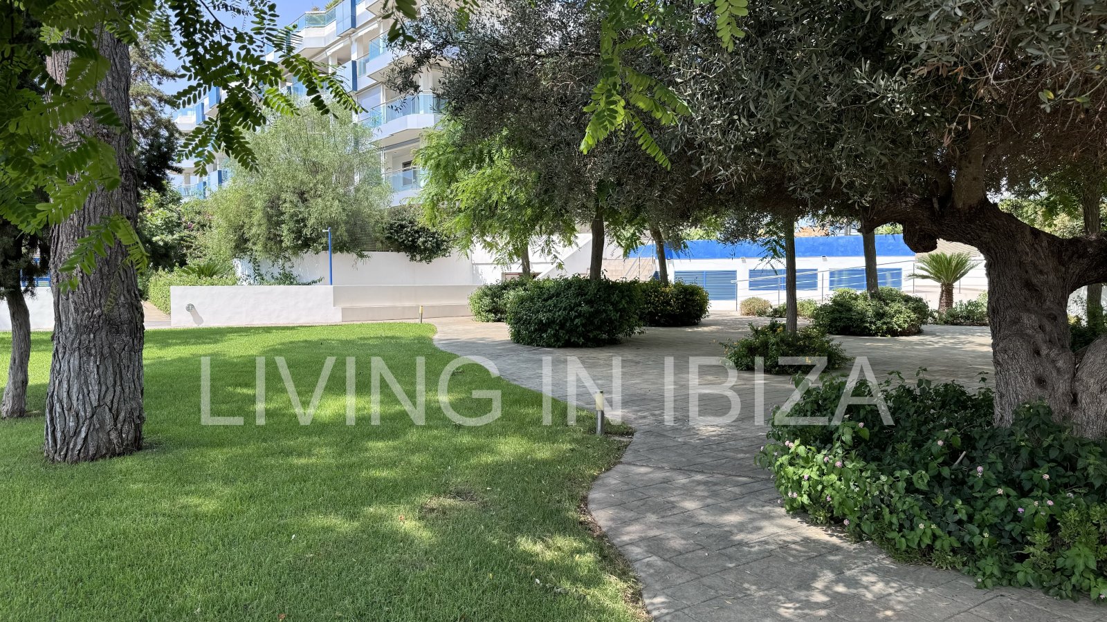 Bright and comfortable 2 bedroom ground floor apartment with terrace, pool, garage, near the beach in Santa Eulalia, Ibiza for long term rental