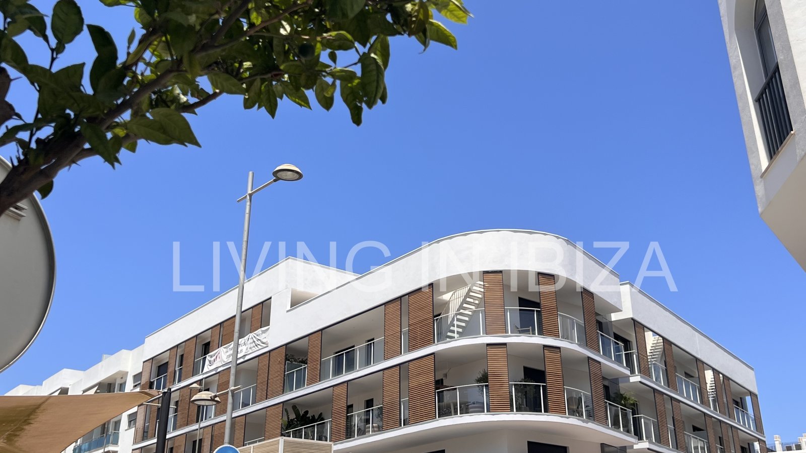 Annual rental. Available 15th July. Attractive and modern new unfurnished flat, with communal pool, parking, in Santa Eulalia, Ibiza.