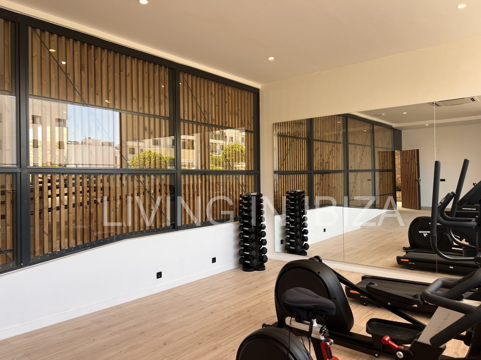 Annual rental. Available 15th July. Attractive and modern new unfurnished flat, with communal pool, parking, in Santa Eulalia, Ibiza.