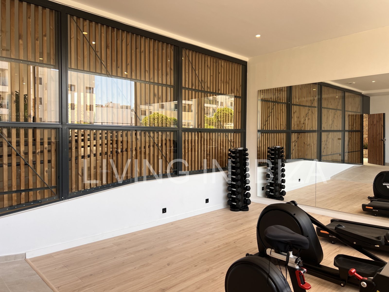 Annual rental. Available 15th July. Attractive and modern new unfurnished flat, with communal pool, parking, in Santa Eulalia, Ibiza.