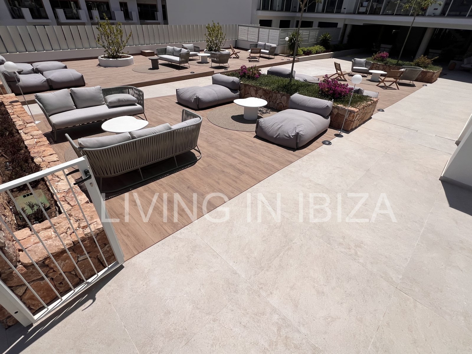 Annual rental. Available 15th July. Attractive and modern new unfurnished flat, with communal pool, parking, in Santa Eulalia, Ibiza.