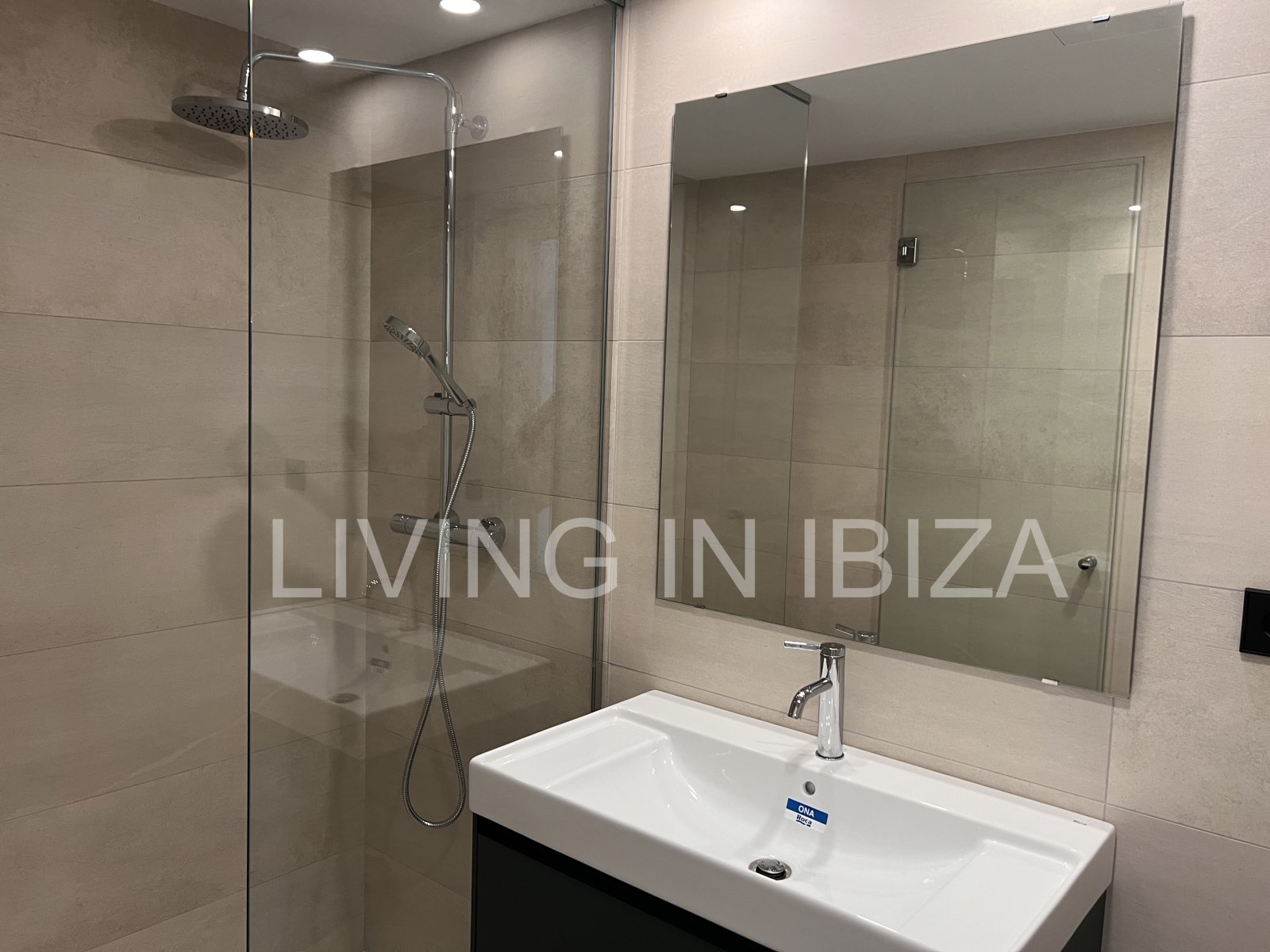 Annual rental. Available 15th July. Attractive and modern new unfurnished flat, with communal pool, parking, in Santa Eulalia, Ibiza.