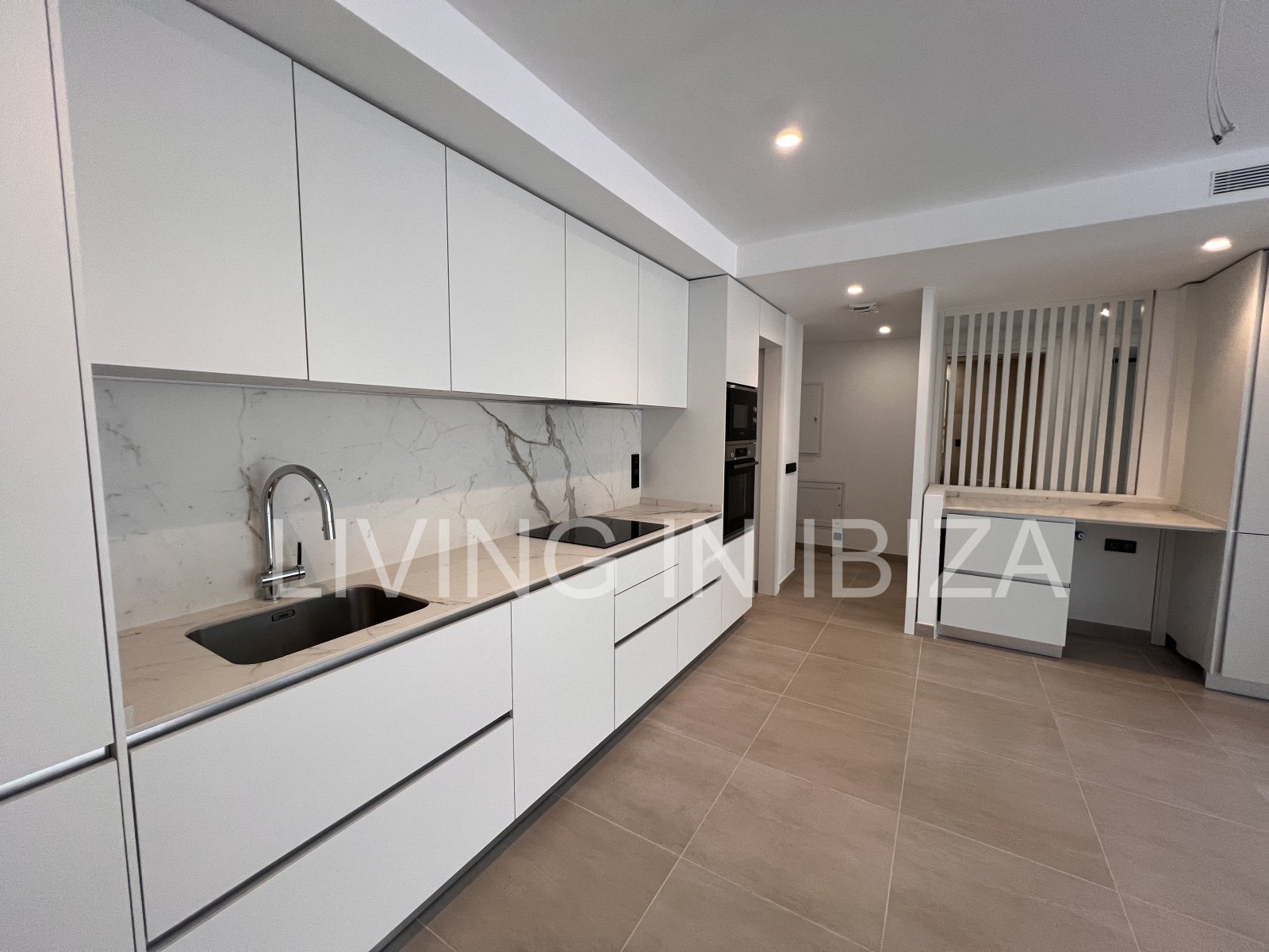 Annual rental. Available 15th July. Attractive and modern new unfurnished flat, with communal pool, parking, in Santa Eulalia, Ibiza.