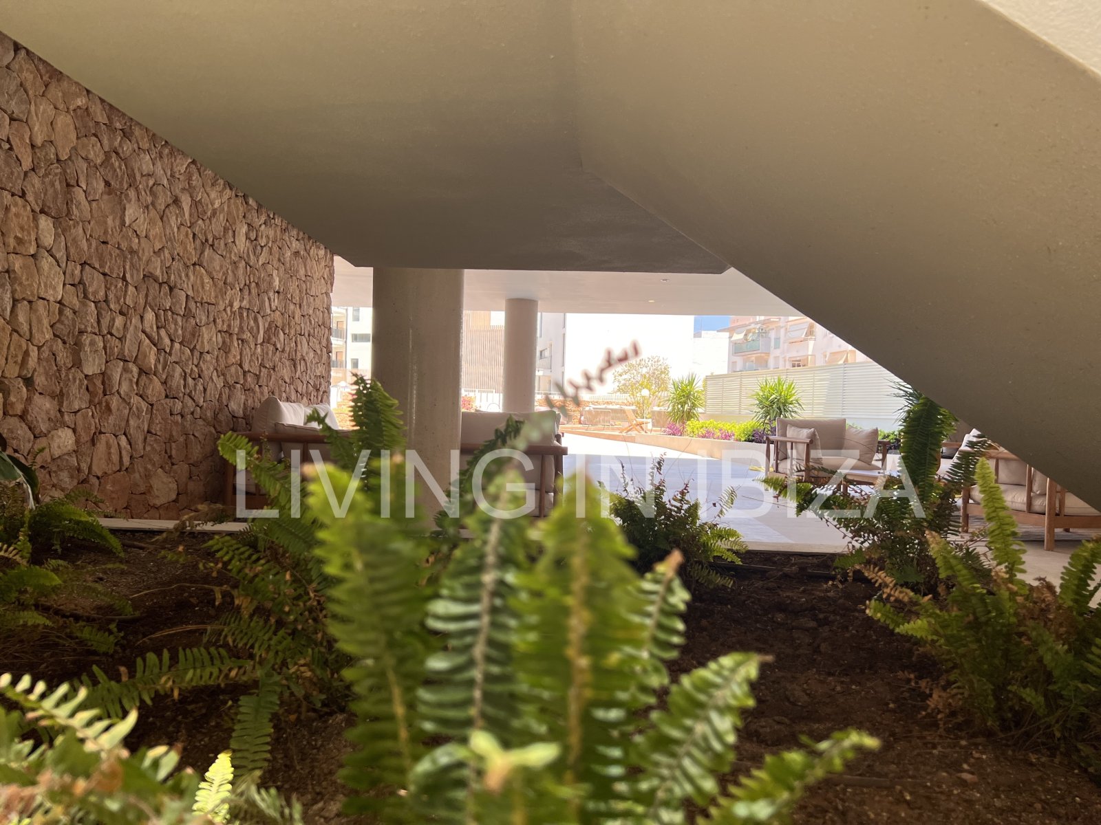 Annual rental. Available 15th July. Attractive and modern new unfurnished flat, with communal pool, parking, in Santa Eulalia, Ibiza.