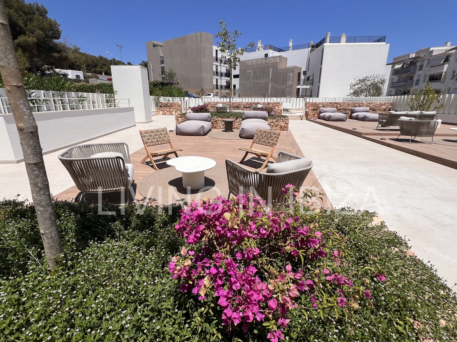 Annual rental. Available 15th July. Attractive and modern new unfurnished flat, with communal pool, parking, in Santa Eulalia, Ibiza.