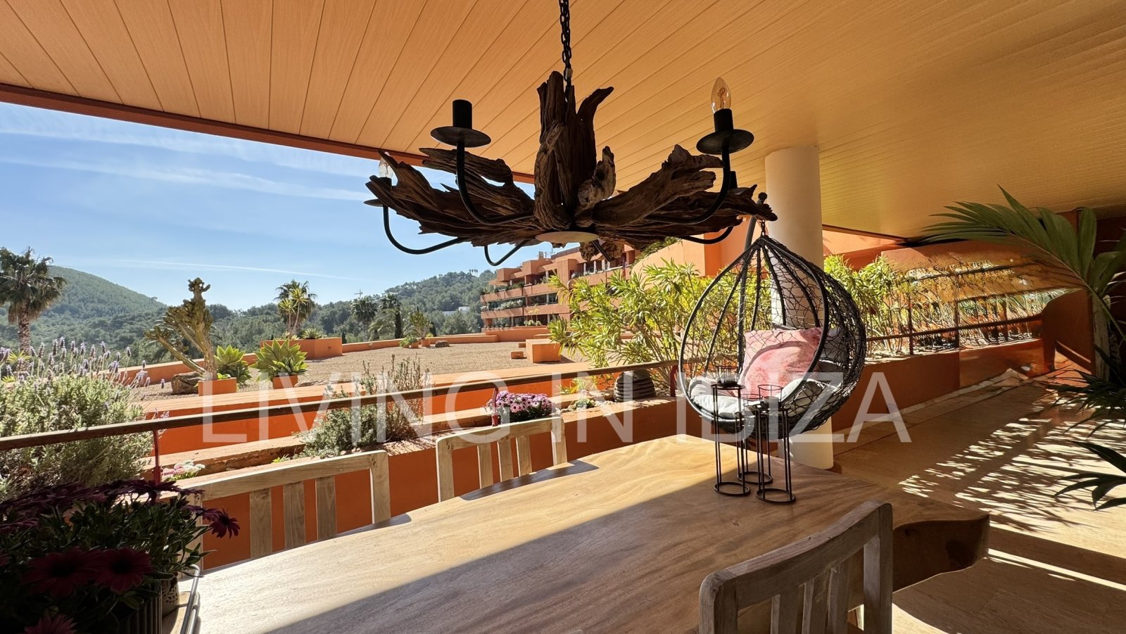 For sale: A flat in Roca Llisa, Ibiza, with a large sun terrace, two bedrooms, a pool, and a parking space.