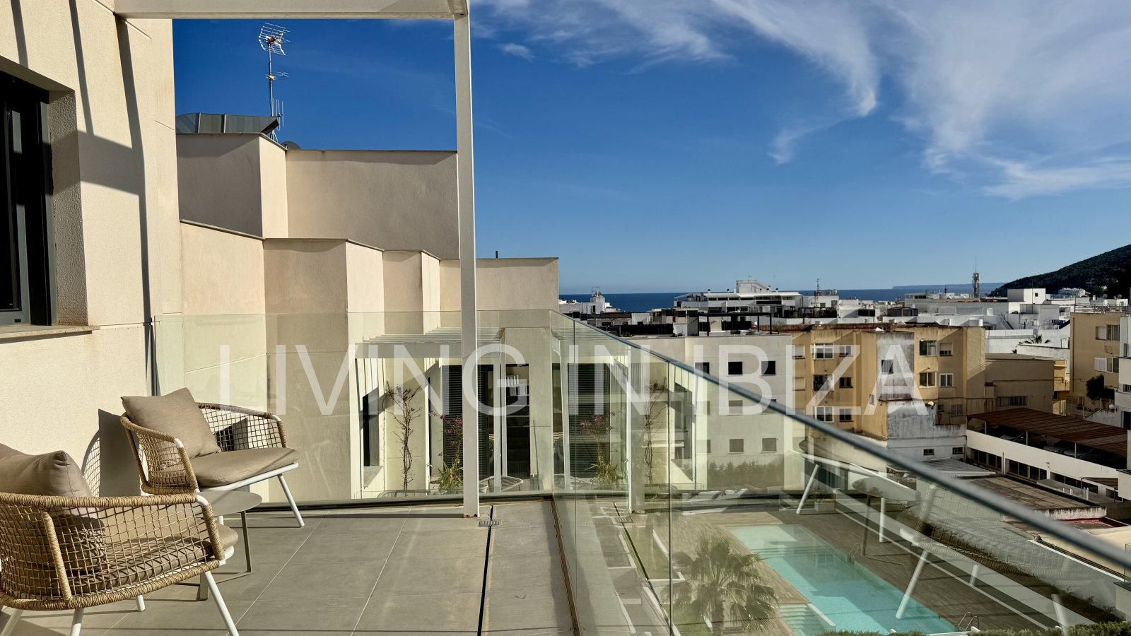 FOR SALE: Exclusive, designer penthouse with distant sea views in Santa Eulalia del Río, Ibiza. Parking, communal pool and storage room.