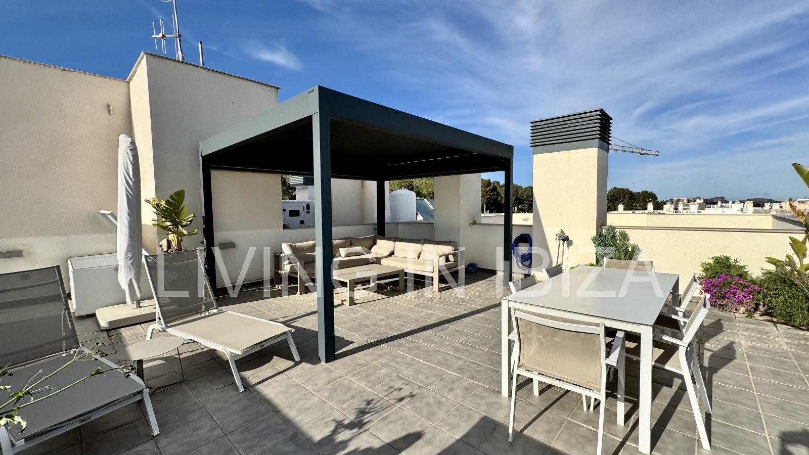 FOR SALE: Exclusive, designer penthouse with distant sea views in Santa Eulalia del Río, Ibiza. Parking, communal pool and storage room.