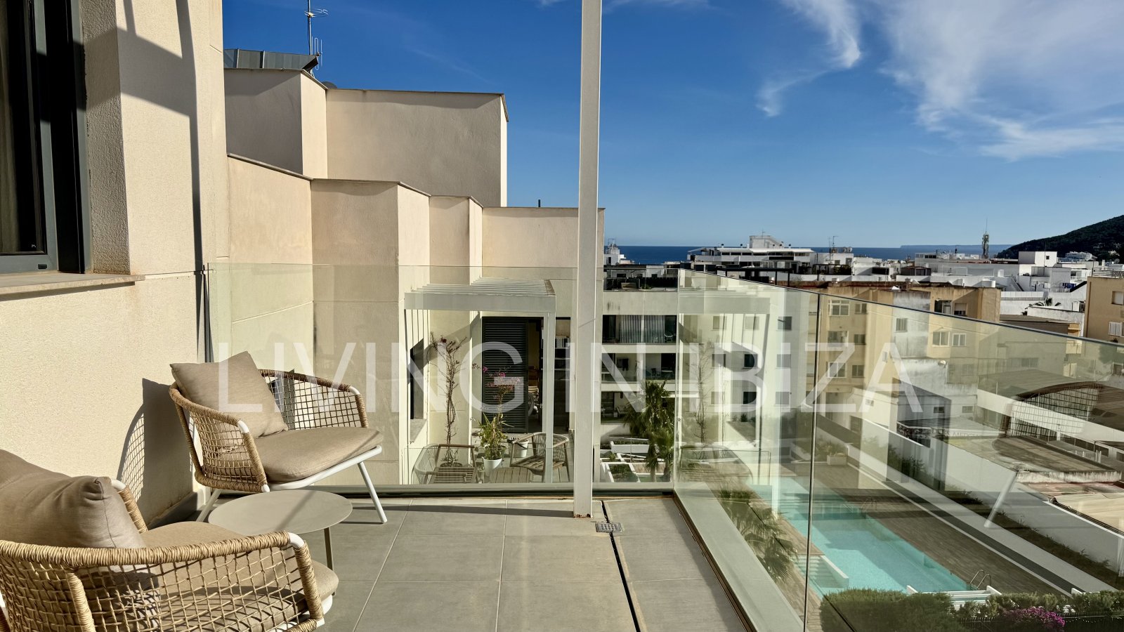 FOR SALE: Exclusive, designer penthouse with distant sea views in Santa Eulalia del Río, Ibiza. Parking, communal pool and storage room.