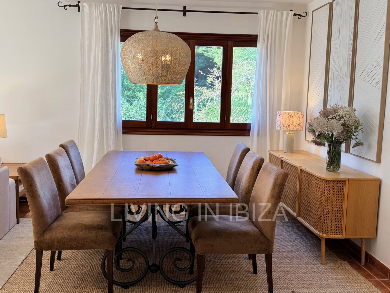 Seasonal rental. Mediterranean elegance in a privileged setting within a seafront residential community in Santa Eulalia del Río, Ibiza.